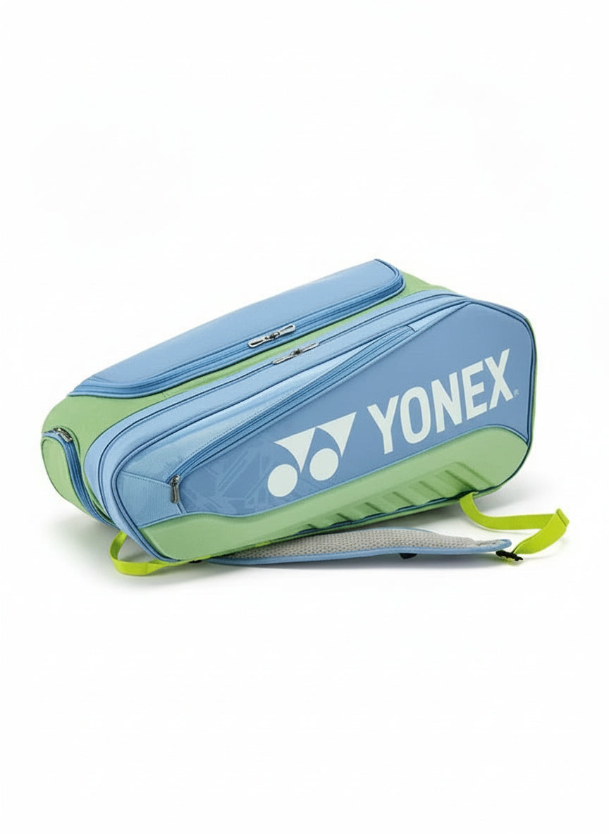 Blue and green Yonex bag on a white background